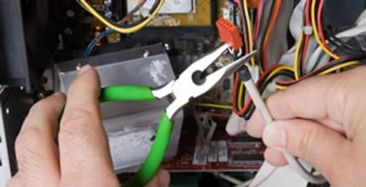 Licensed electrical contractor performing electrical repair with tools in Dayton, NV