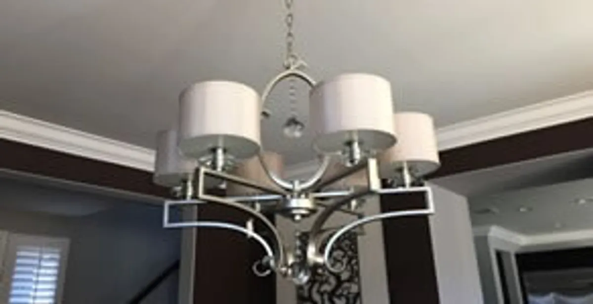 Modern chandelier installation with multiple light fixtures in Reno, NV